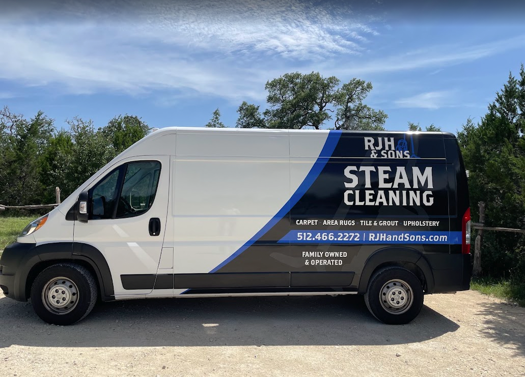 The RJH & Sons Steam Cleaning van parked in the Texas Hill Country