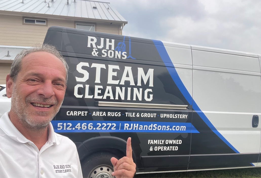Rob standing beside the RJH & Sons Steam Cleaning van
